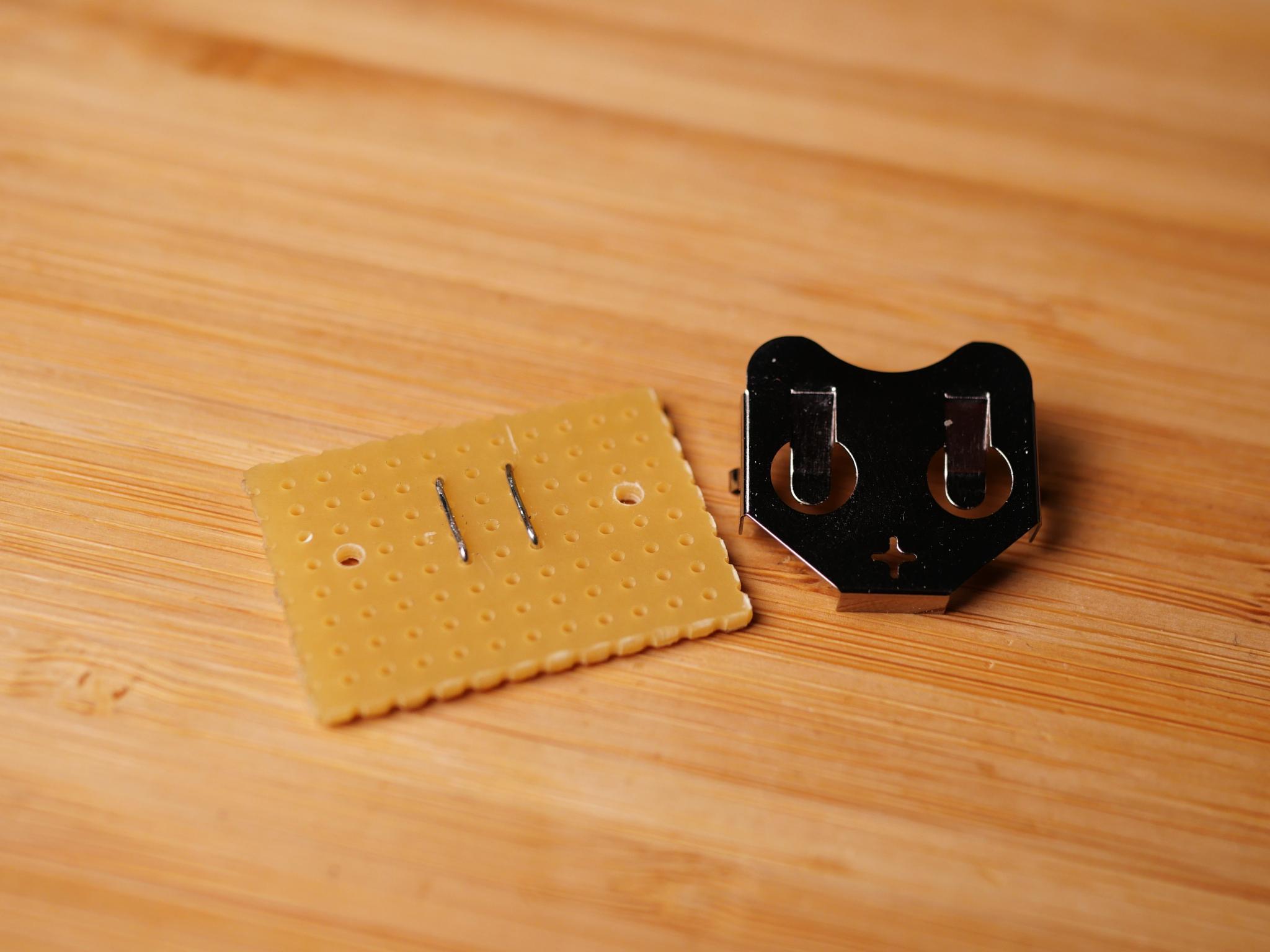 Prepare the perfboard for the battery clip